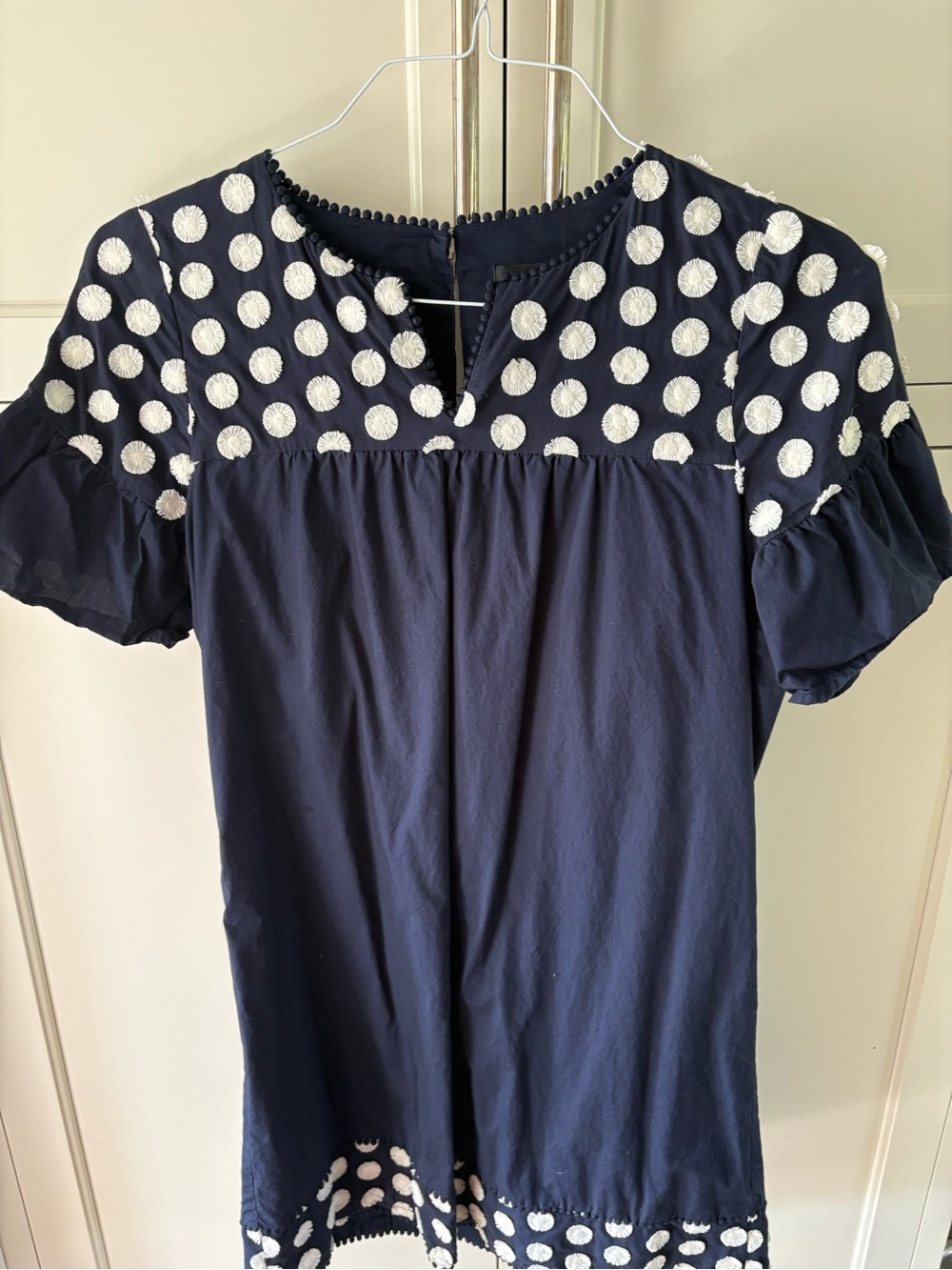 J.Crew Women’s Navy Polka Dot Short Sleeve Top with puff sleeves.